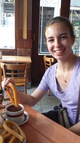 Kelsey with her first churros con chocolate of our trip.